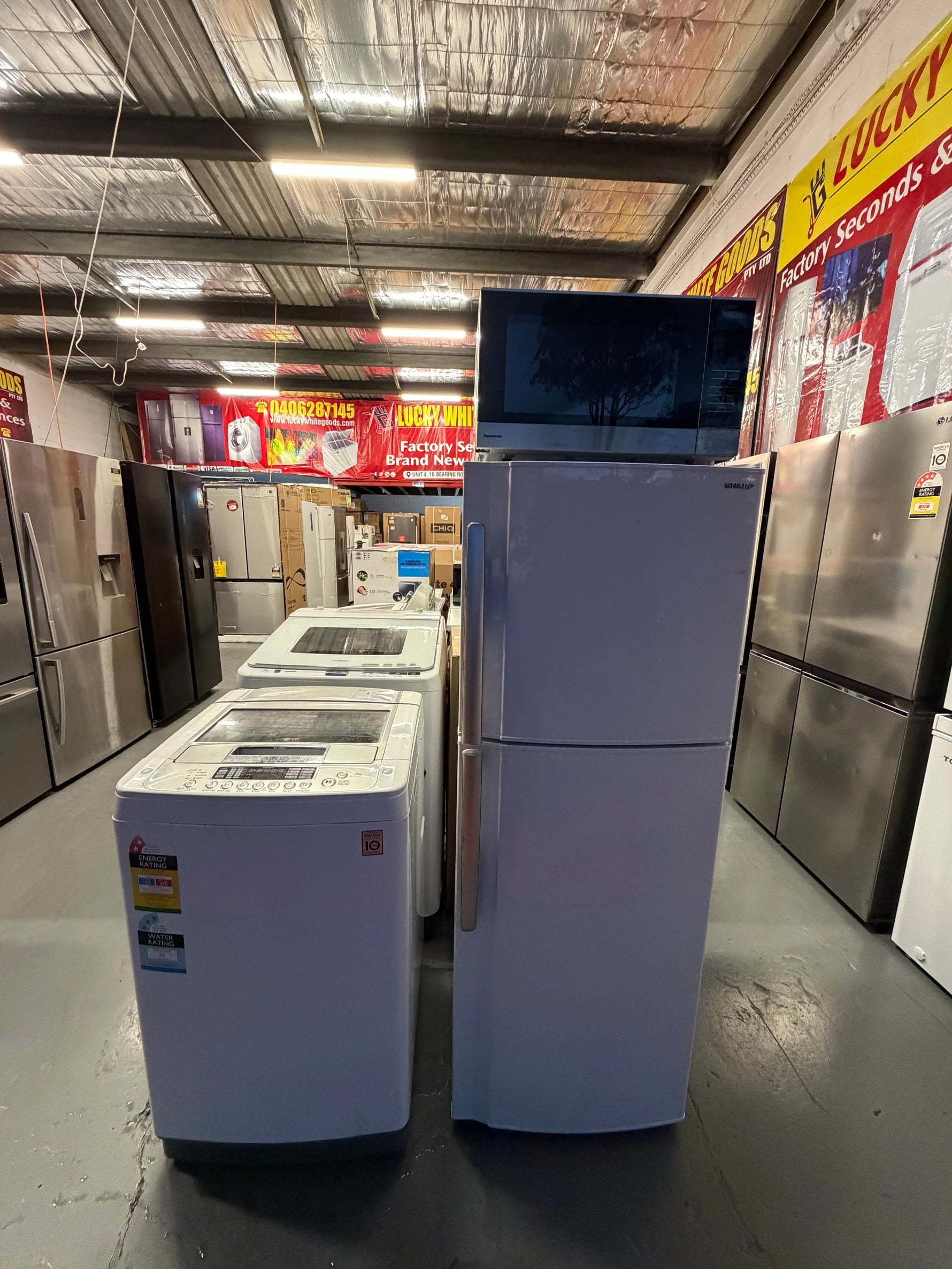 Refurbished combo Sharp  220 Ltr Top mount fridge freezer & Lg 5.5 kg Top loader washer with Panasonic 27 litre microwave